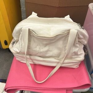 Lo and sons white weekender bag with suitcase sleeve